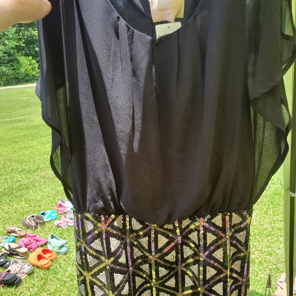 Black  dress with gold and black sequins on the bottom